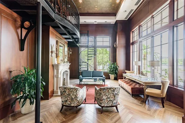 a living room with furniture or couch and a large window