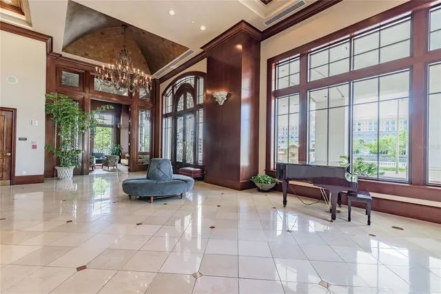a lobby with furniture and floor to ceiling window
