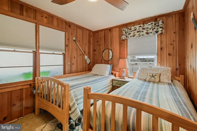 a bedroom with furniture and a wooden floor