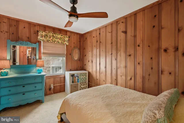 a bed room with a bed and a window