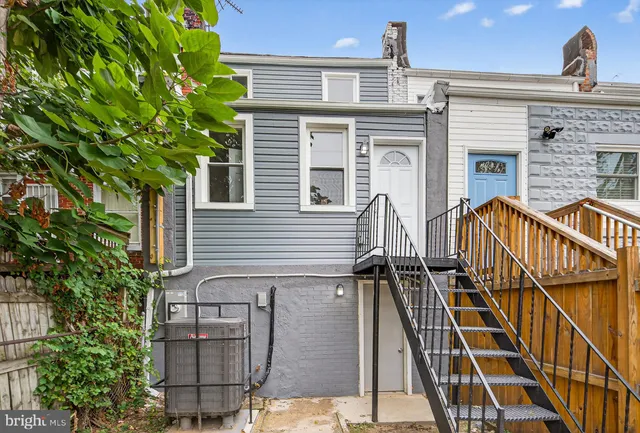 front view of a house with a small deck