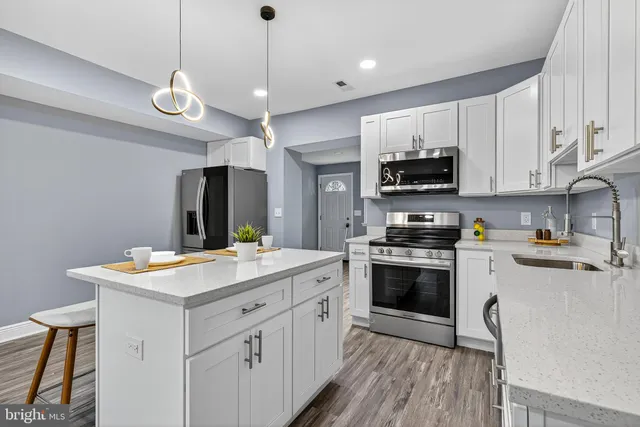 a kitchen with a stove and a microwave