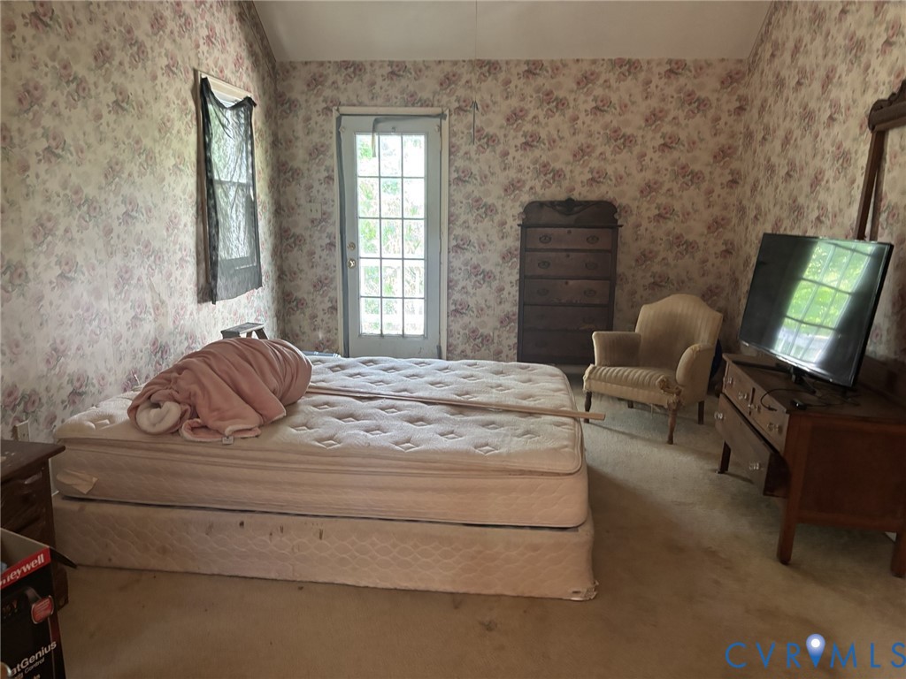 6424 Hackney Circle North Chesterfield, VA 23832 - Photo 16 of 23 a bedroom with a bed and chair