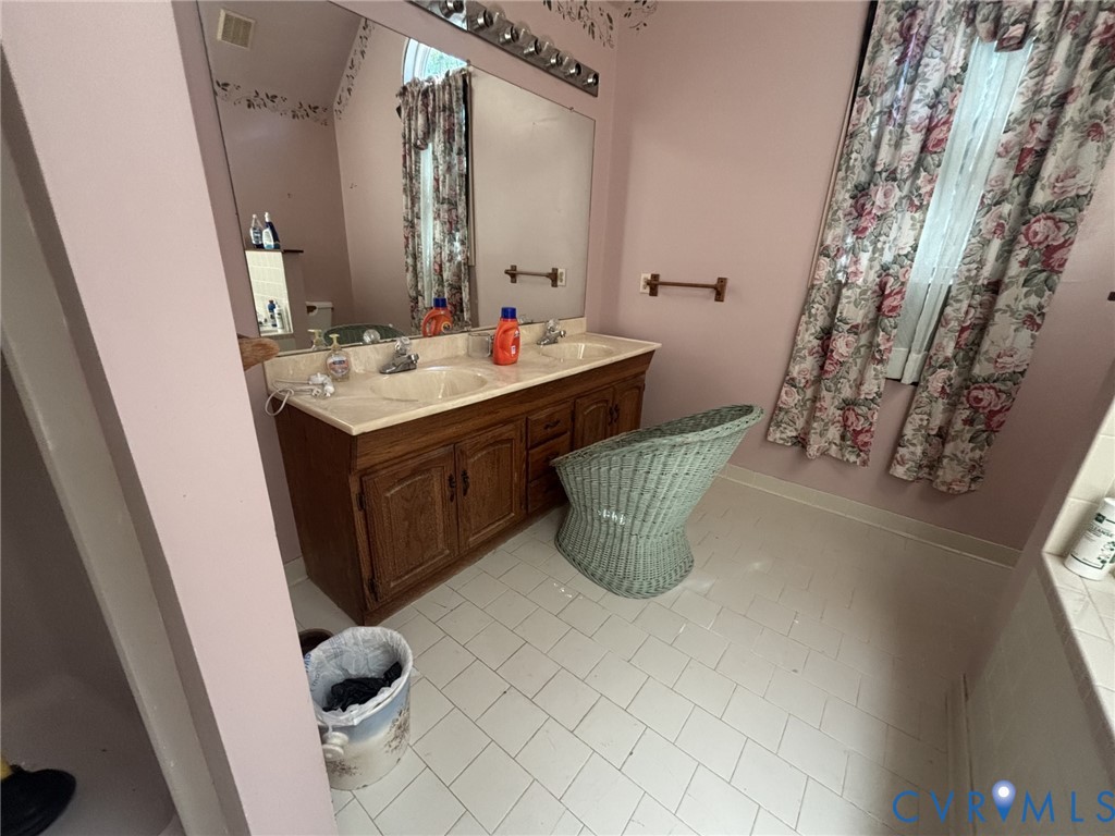 6424 Hackney Circle North Chesterfield, VA 23832 - Photo 17 of 23 a bathroom with a sink and mirror