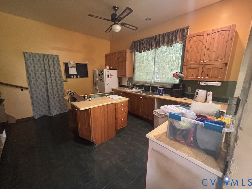 6424 Hackney Circle North Chesterfield, VA 23832 - Photo 9 of 23 a room with kitchen island a sink stove and window
