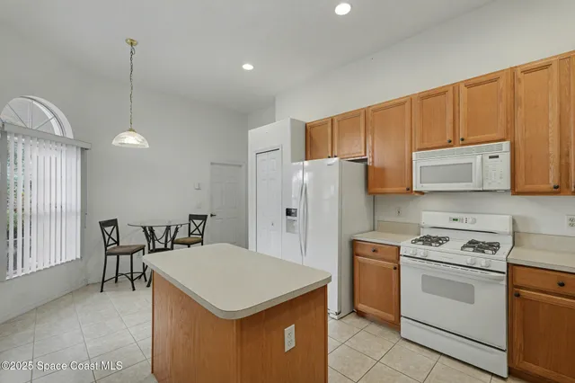 a kitchen that has a cabinets a sink and appliances