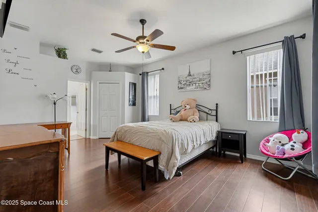 a bedroom with a bed dresser and a window