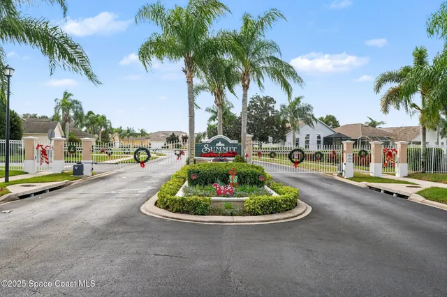 a childrens park with lots of swings slides and swimming pool