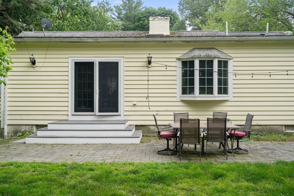 61 Conant Road Westwood, MA 02090 - Photo 8 of 12 a view of a house with a yard and sitting area