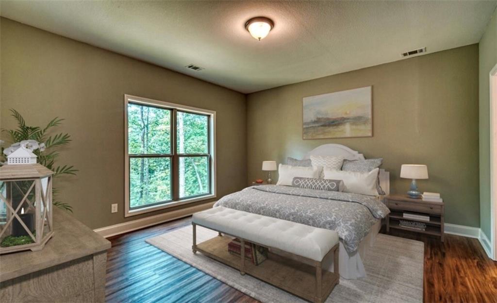 199 Lola Mae Way Morganton, GA 30560 - Photo 14 of 39 a bedroom with a bed and a window