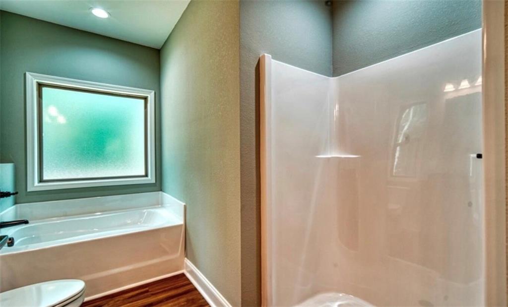 199 Lola Mae Way Morganton, GA 30560 - Photo 17 of 39 a bathroom with a bathtub and a sink