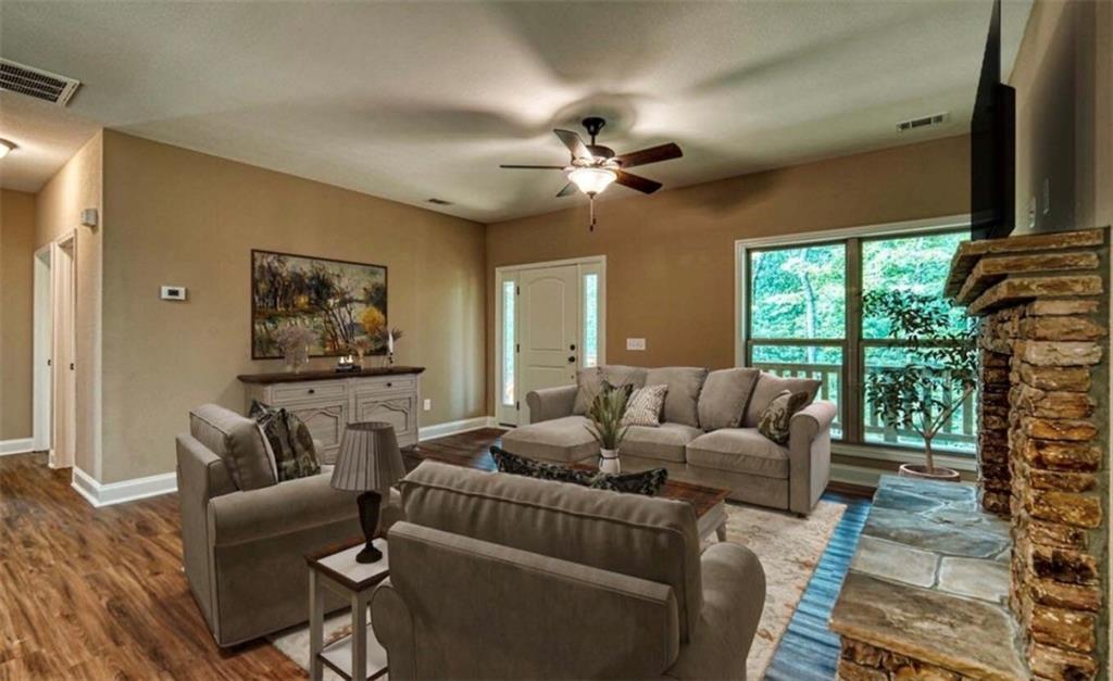 199 Lola Mae Way Morganton, GA 30560 - Photo 24 of 39 a living room with furniture and a flat screen tv