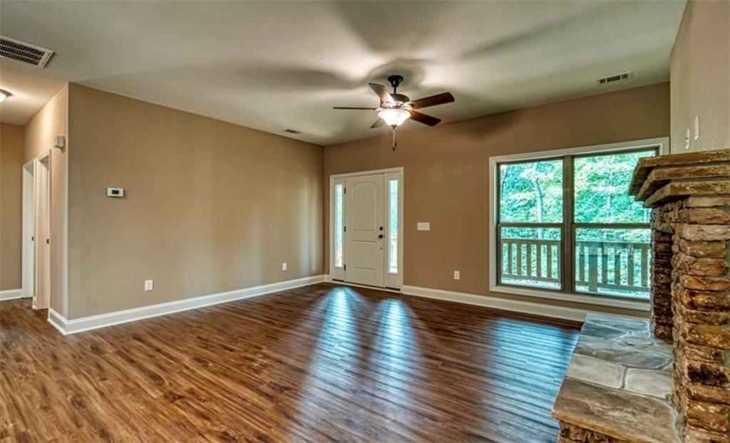 199 Lola Mae Way Morganton, GA 30560 - Photo 25 of 39 a view of empty room with wooden floor and fan