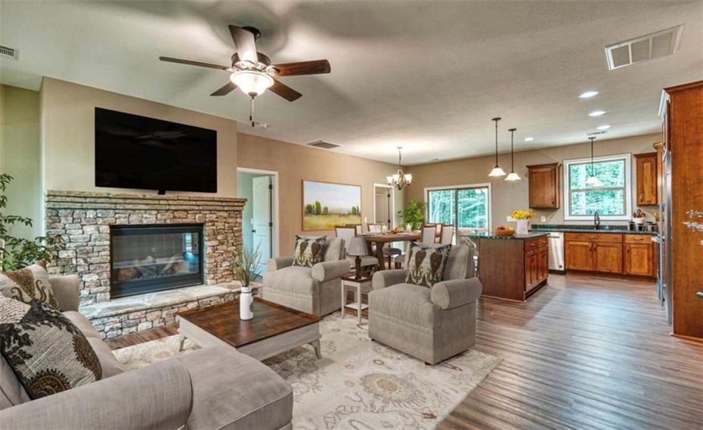 199 Lola Mae Way Morganton, GA 30560 - Photo 5 of 39 a living room with couches fireplace and a flat screen tv