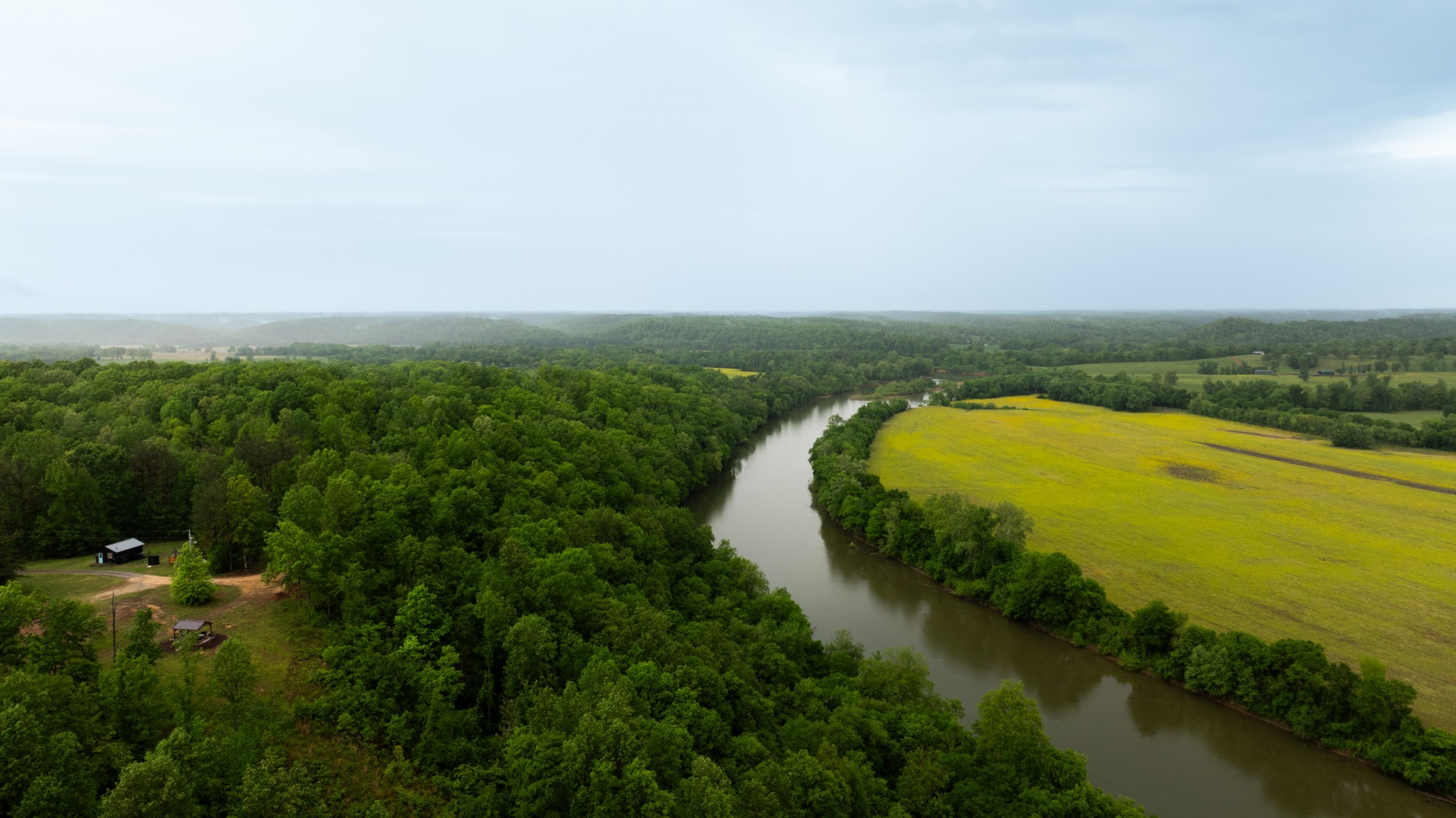 7050 Bakerville Road Waverly, TN 37185 - Photo 2 of 53 a view of a lake with a city