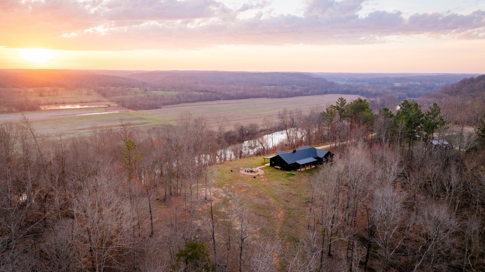 7050 Bakerville Road Waverly, TN 37185 - Photo 4 of 53 a view of a lake with mountains in the background