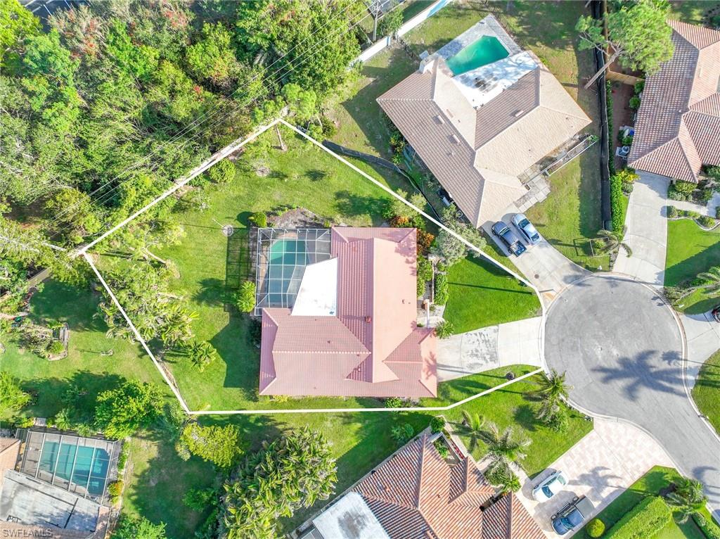 775 Southern Pines Drive Naples, FL 34103 - Photo 4 of 7 an aerial view of residential house with outdoor space and trees