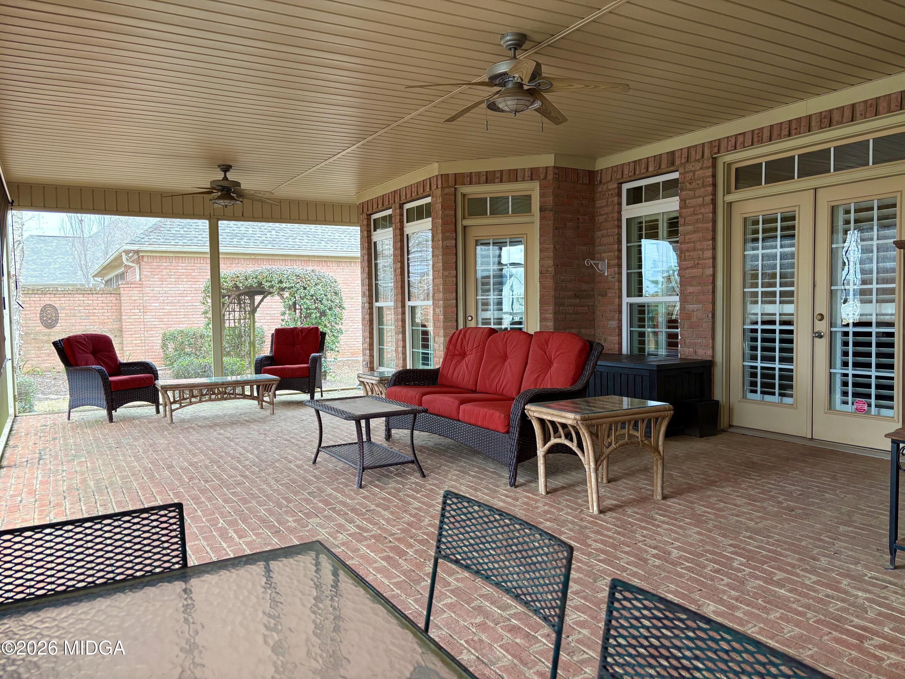 119 Bartlett Way Centerville, GA 31028 - Photo 14 of 48 a living room with furniture a large window and a table