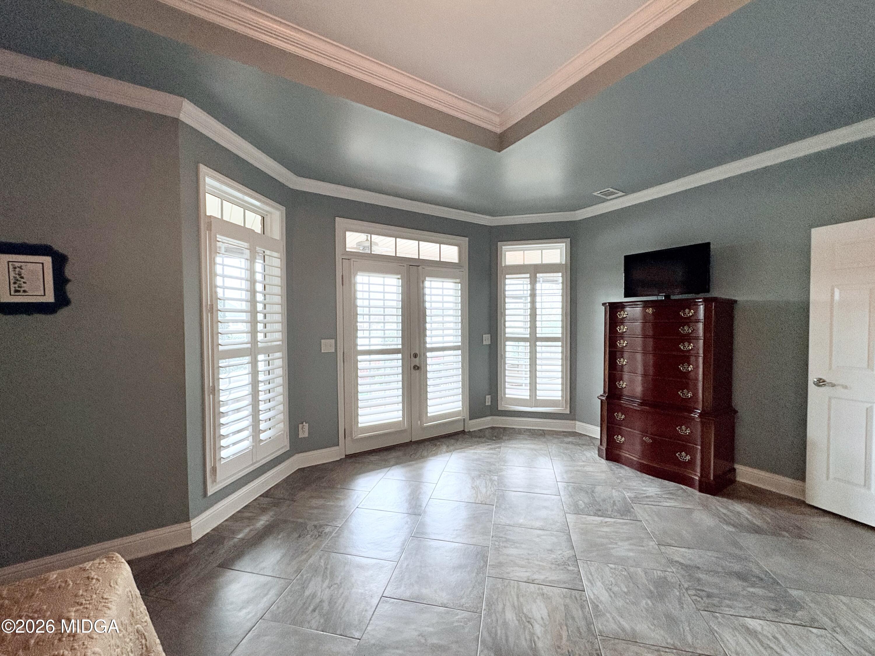 119 Bartlett Way Centerville, GA 31028 - Photo 21 of 48 a view of an empty room with a fireplace and a window