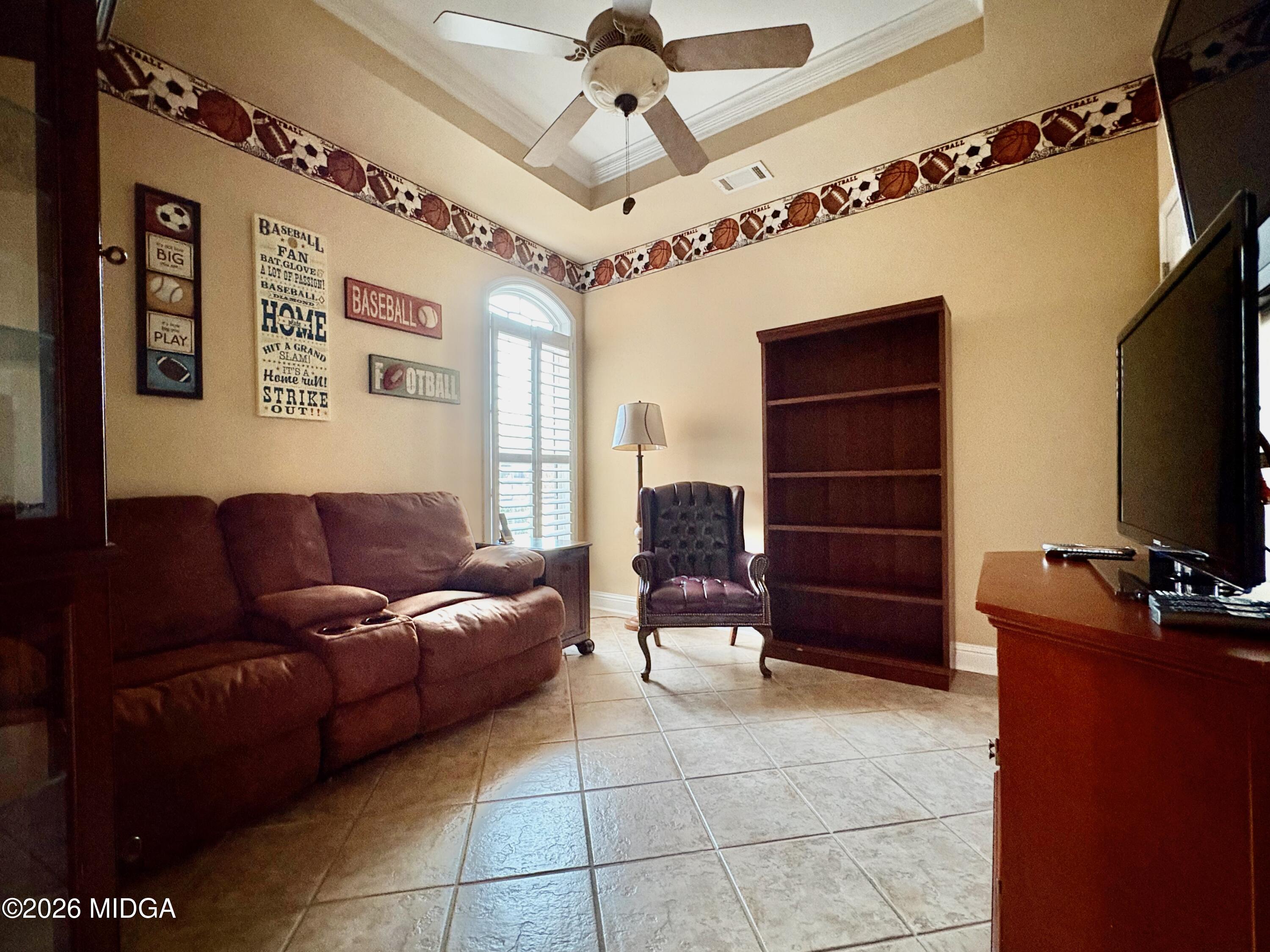 119 Bartlett Way Centerville, GA 31028 - Photo 28 of 48 a living room with furniture a ceiling fan and a window