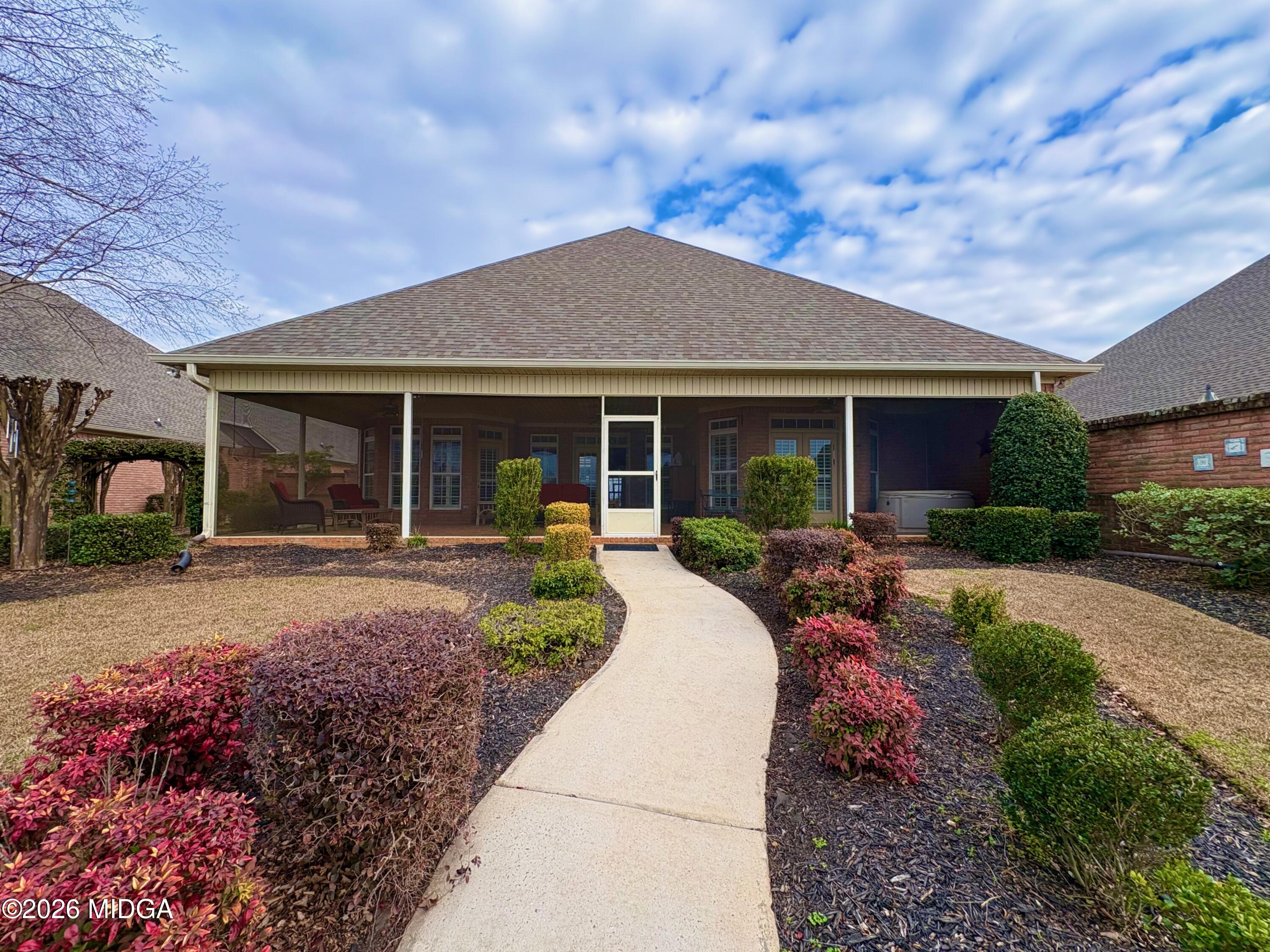 119 Bartlett Way Centerville, GA 31028 - Photo 34 of 48 a front view of a house with garden and porch