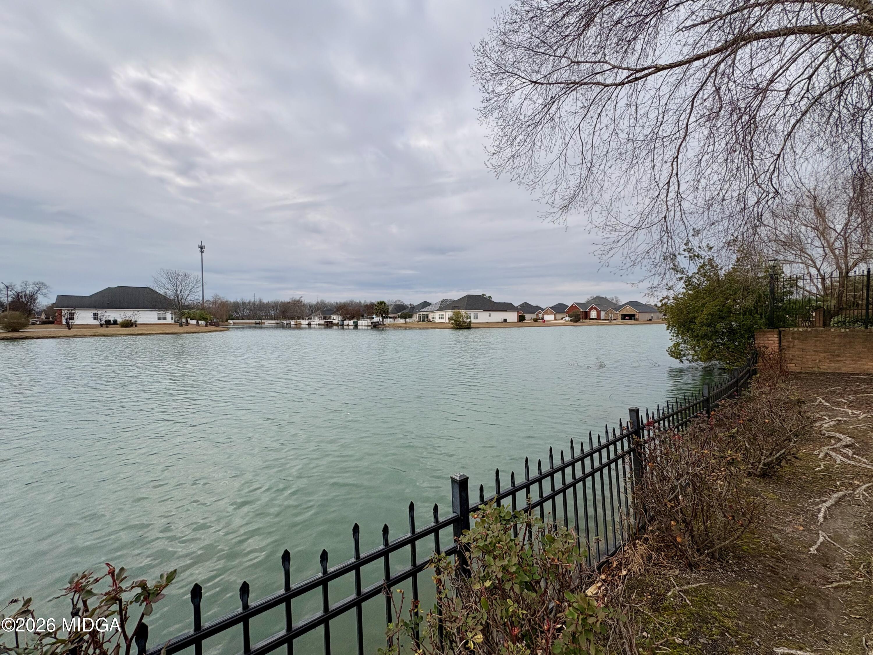119 Bartlett Way Centerville, GA 31028 - Photo 36 of 48 a view of a lake with a city view