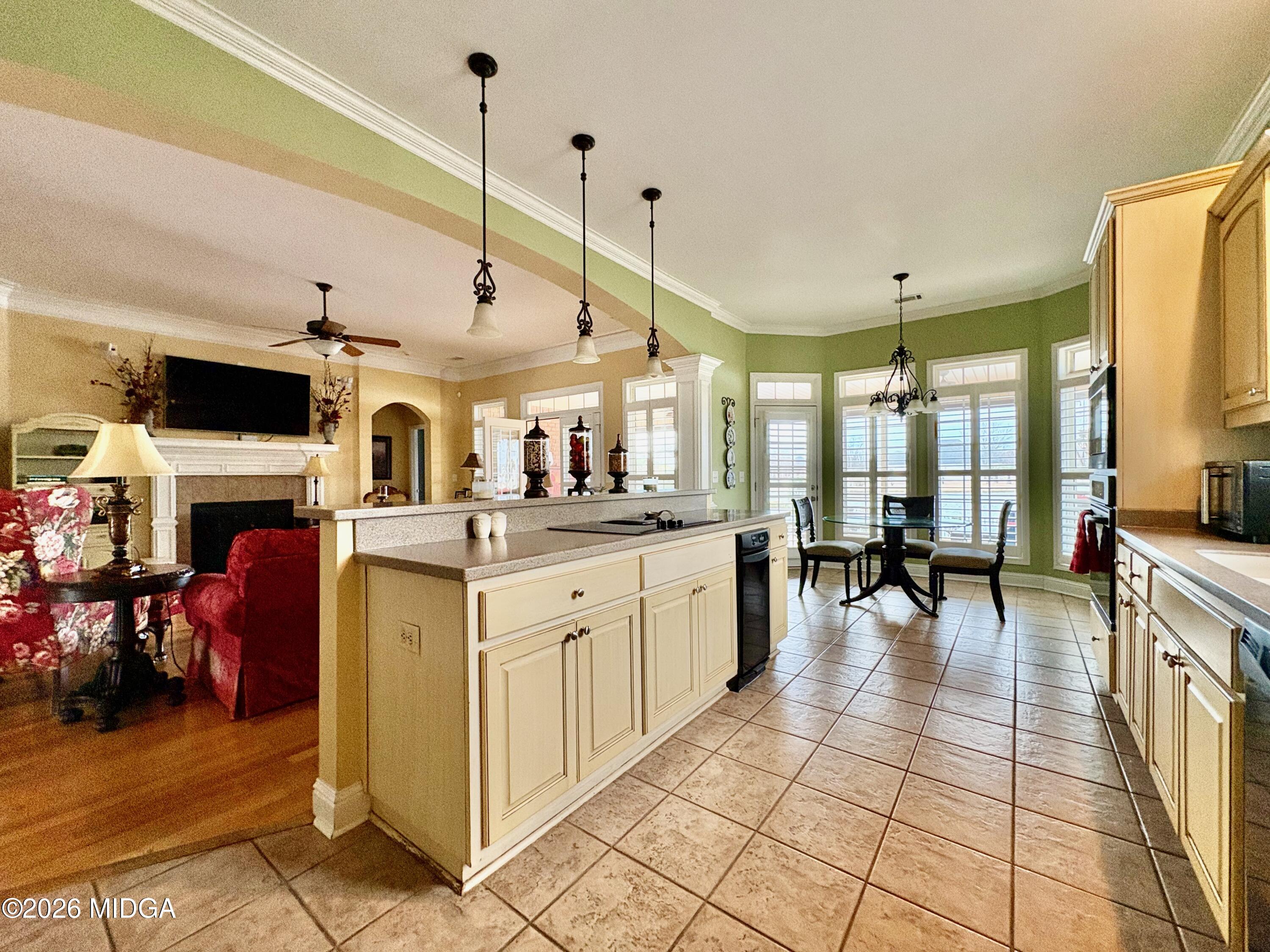 119 Bartlett Way Centerville, GA 31028 - Photo 9 of 48 a kitchen with stainless steel appliances kitchen island granite countertop a sink and cabinets
