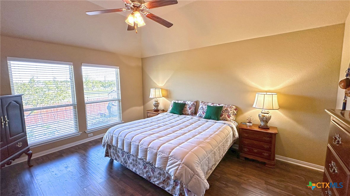 4709 Farrell Lane Killeen, TX 76549 - Photo 15 of 30 a bedroom with a bed and a chandelier