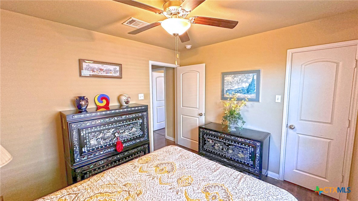 4709 Farrell Lane Killeen, TX 76549 - Photo 26 of 30 a living room with furniture a flat screen tv and a fireplace
