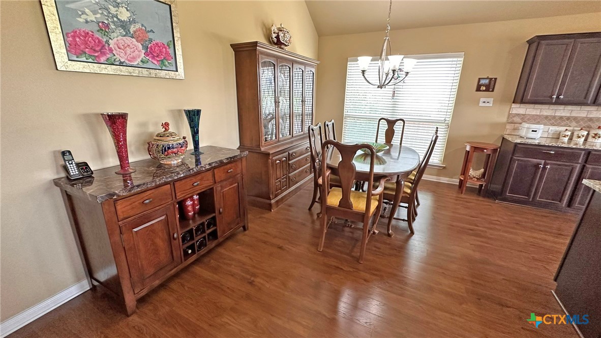 4709 Farrell Lane Killeen, TX 76549 - Photo 5 of 30 a view of a dining room with furniture window and wooden floor