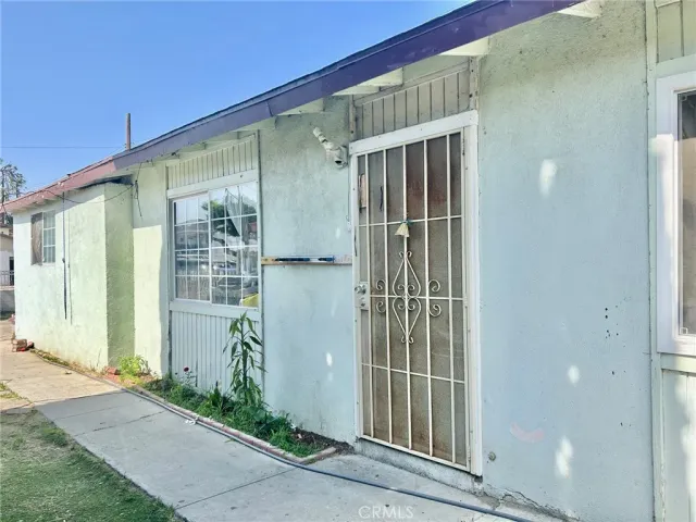 a kitchen with refrigerator and cabinets
