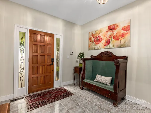 a living room with furniture and a rug