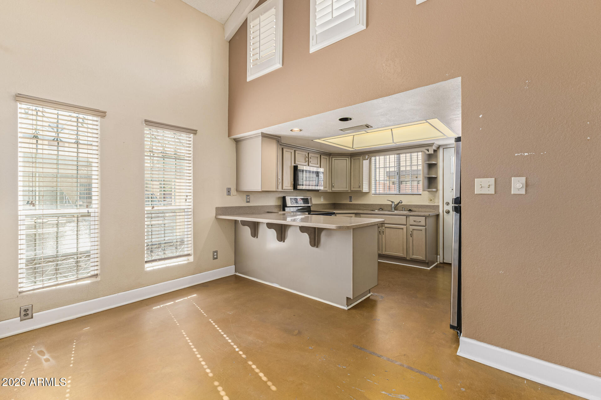 2930 North 22nd Place Phoenix, AZ 85016 - Photo 12 of 41 a kitchen with a sink cabinets and window