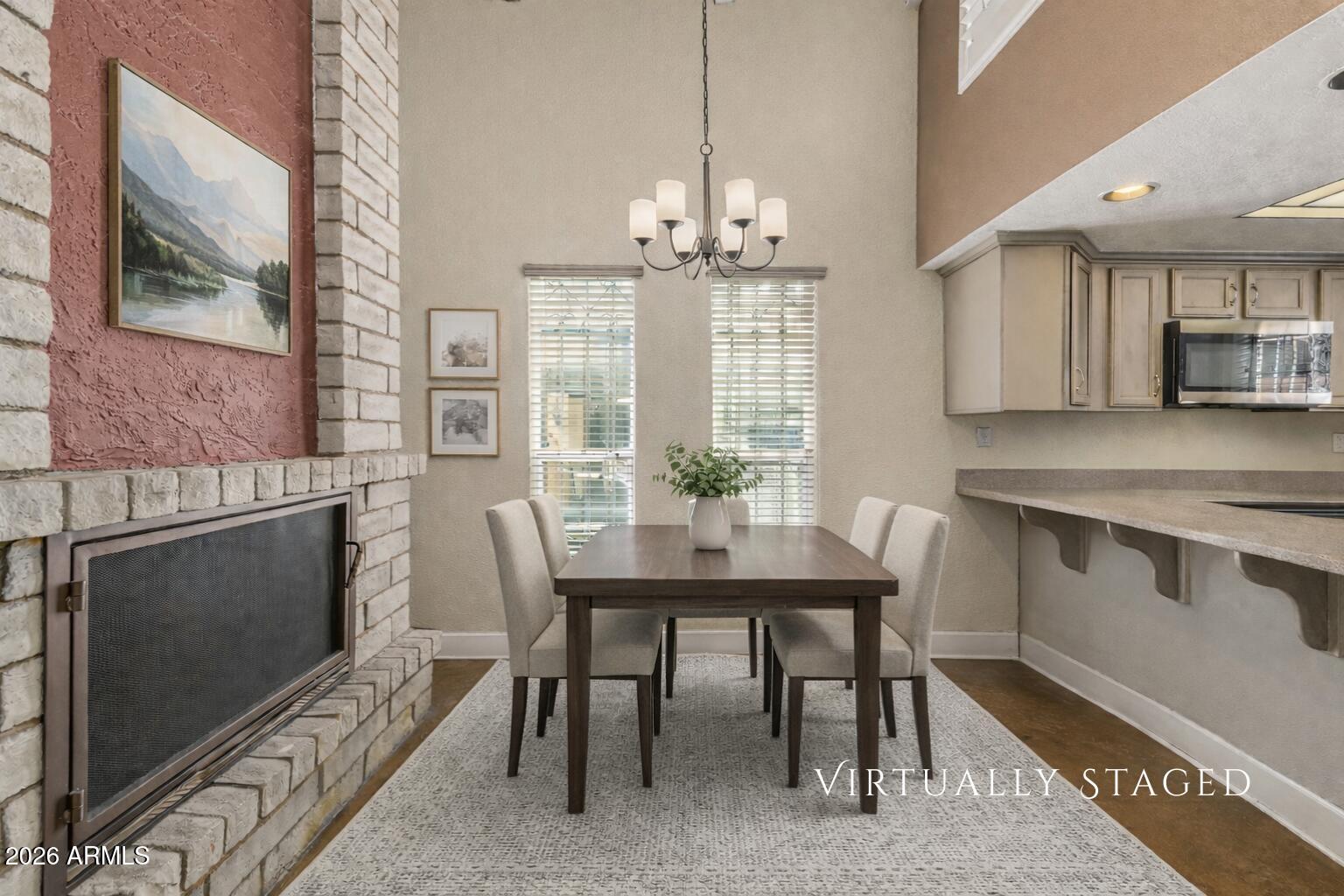 2930 North 22nd Place Phoenix, AZ 85016 - Photo 13 of 41 a view of a dining room with furniture window and wooden floor