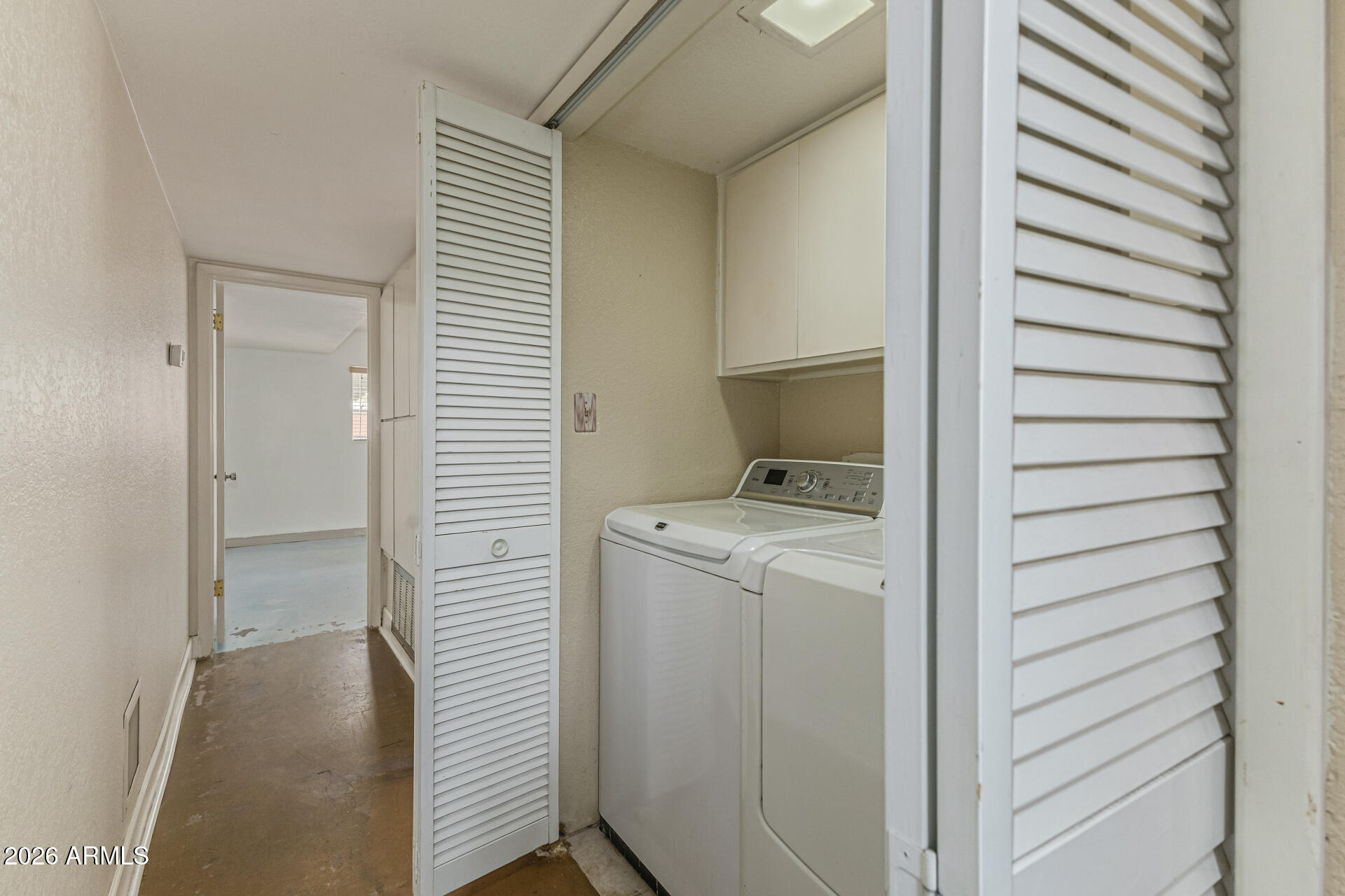 2930 North 22nd Place Phoenix, AZ 85016 - Photo 36 of 41 a view of storage and utility room with washer and dryer
