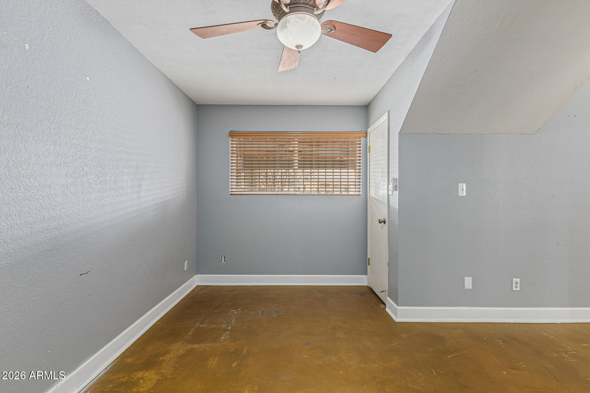 2930 North 22nd Place Phoenix, AZ 85016 - Photo 4 of 41 a view of an empty room with a window