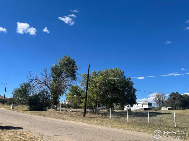 a view of a yard in front of a house