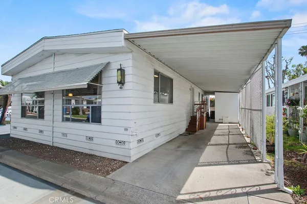 a view of a building with car parked