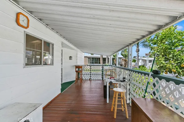 a outdoor space with wooden floor and windows