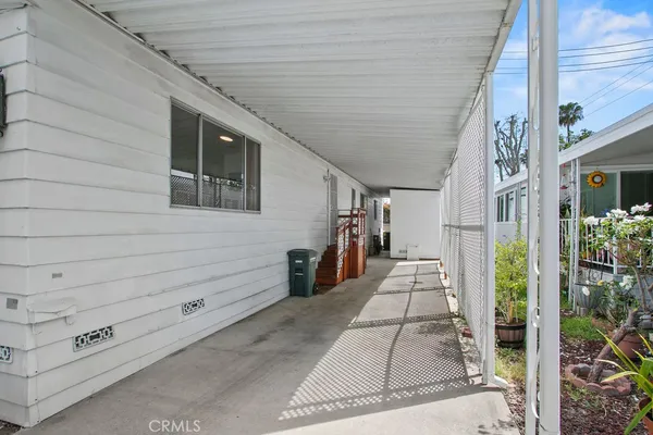 a view of a pathway along the house