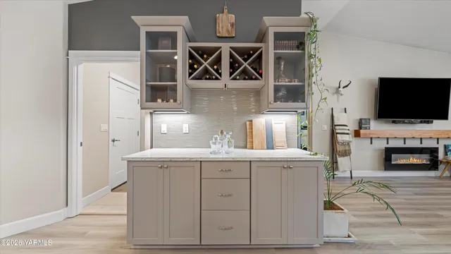 a living room with fireplace furniture and a flat screen tv