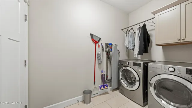 a view of storage and utility room with washer and dryer