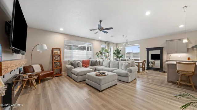 a living room with furniture or couch and a wooden floor
