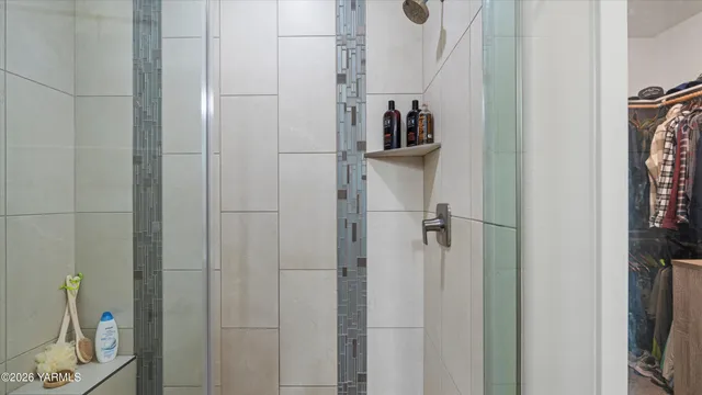 a bathroom with a double vanity sink and mirror