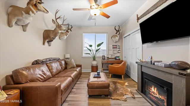 a living room with furniture fireplace and flat screen tv
