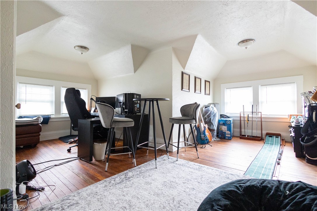 2261 Maplewood Road Cleveland, OH 44118 - Photo 20 of 44 Office space featuring a wealth of natural light, vaulted ceiling, and dark hardwood / wood-style flooring