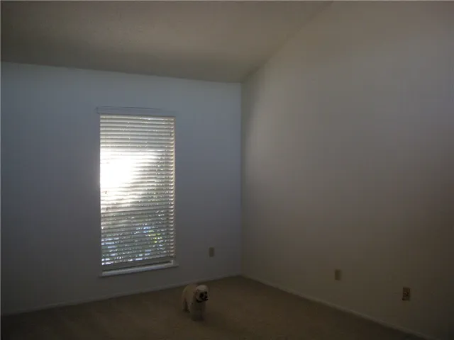 a kitchen with windows and entrance