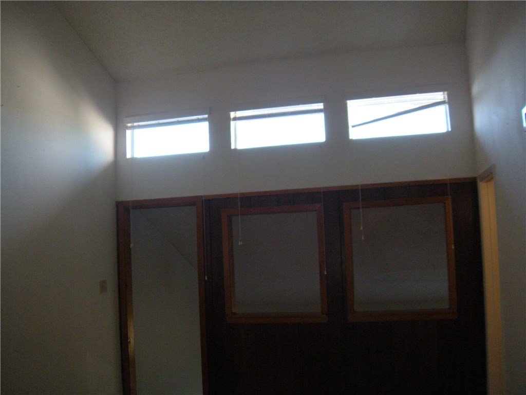6910 Hart Lane, Unit 502 Austin, TX 78731 - Photo 13 of 16 a kitchen with windows and entrance