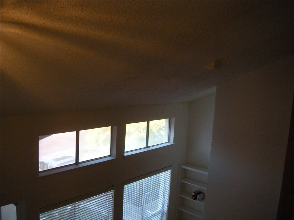 6910 Hart Lane, Unit 502 Austin, TX 78731 - Photo 4 of 16 a view of an empty room and window