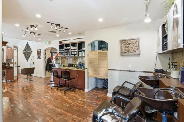 a kitchen with sink refrigerator and cabinets